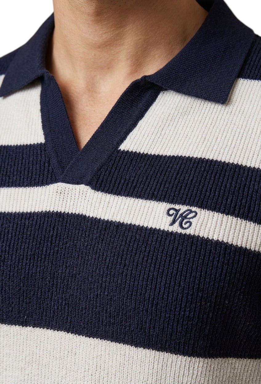 Velmior Cavelle navy and white striped knit polo sweater with a collared V-neck and embroidered logo detail.