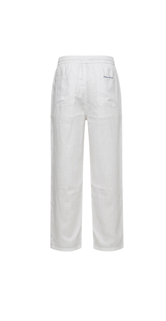 Velmior Cavelle white relaxed linen pants with an elastic waistband and back pockets, shown from the back view.